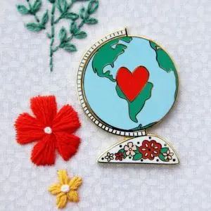 Vintage Globe Enamel Needle Minder